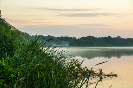 Pre-dawn river Don near the village of Kazan, Rostov region of Russia. Light fog spreads over mirror-smooth waterの写真素材