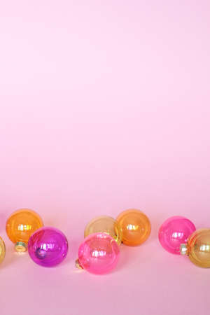 Creative christmas balls decoration on pink backround. Plase for textの写真素材