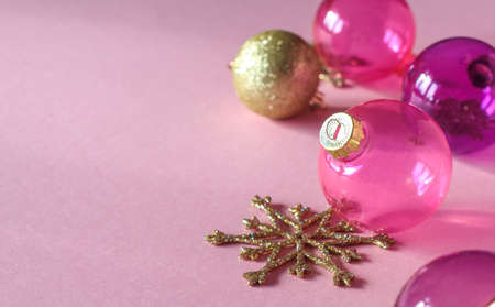 Christmas decoration on pink background. Closeup of pink and gold christmas ballsの写真素材