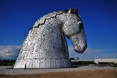 One steel structure of a horses head, built next to the Forth & Clyde canal. Named the Kelpies from a mythical powerfull horse like creature.のeditorial素材