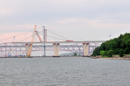 Construction of the new Forth Road Bridge taken from the south shore, with the original road bridge...