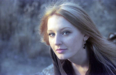 Girl in a natural lateral light of setting sun Cold cinematography color 