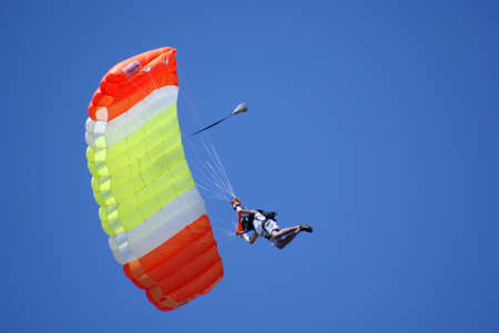man on paraglider in the skyの写真素材