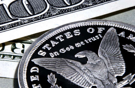silver eagle in god we trust coin and bills  の写真素材