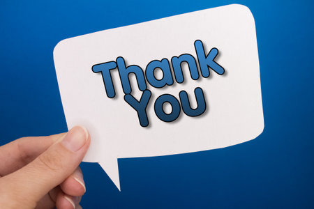 Speech bubble in front of colored background with Thank You text.の写真素材