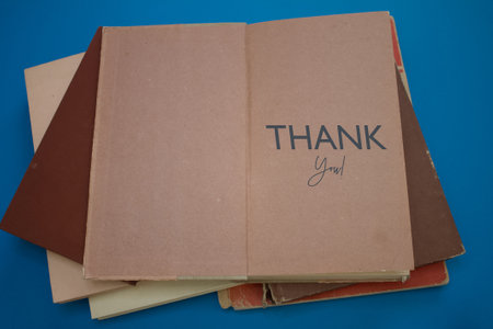 Thank You word in opened book with vintage, natural patterns old antique paper design.の写真素材