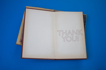 Thank You word in opened book with vintage, natural patterns old antique paper design.の写真素材