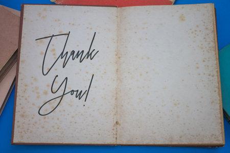 Thank You word in opened book with vintage, natural patterns old antique paper design.の写真素材