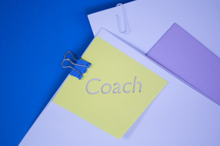 Coach. Text on adhesive note paper. Event, celebration reminder message.