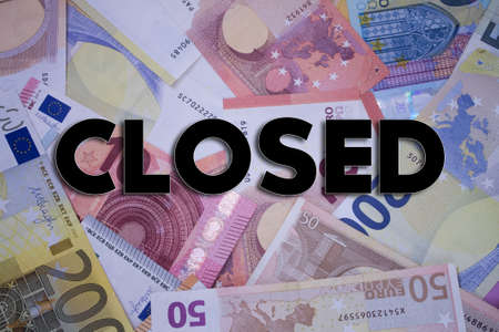 Closed word with money. Paper currency background with different banknotes.の写真素材