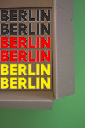 Berlin word with cardboard box. Brown folded cardbox.