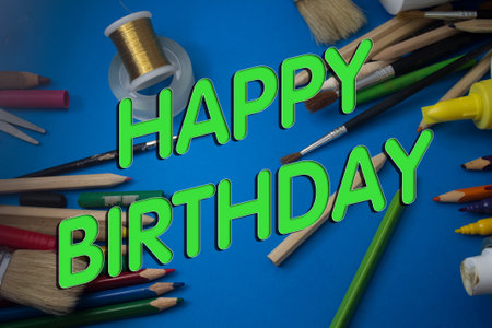 Overhead shot of school supplies with Happy Birthday text. Brushes, pencils, artistic tools. Art And Craft Work Tools.の写真素材