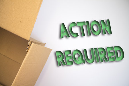 Action Required word with cardboard box. Brown folded card box.