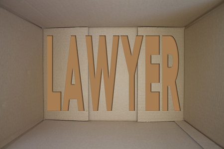 Lawyer word with cardboard box. Brown folded card box.の写真素材