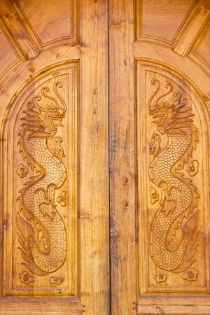 Dragon wood door Chinese villageの写真素材