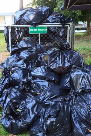Many black waste bagの写真素材
