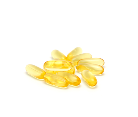 Fish oil capsules isolated on white backgroundの写真素材
