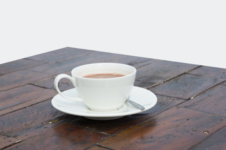Coffee on wooden table on white backgroundの写真素材