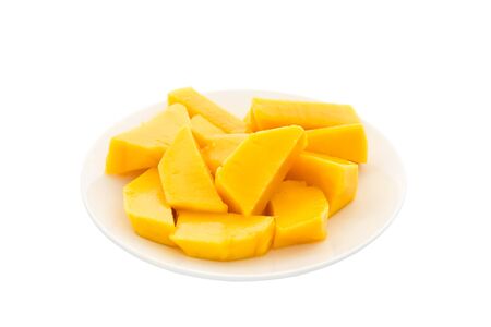 Mango slices in plate isolated on white backgroundの写真素材
