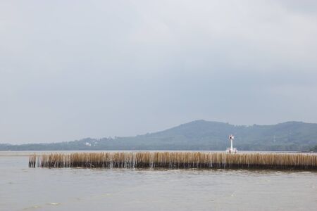 Wood barrier in the sea