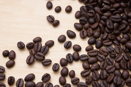 Coffee beans on woodの写真素材