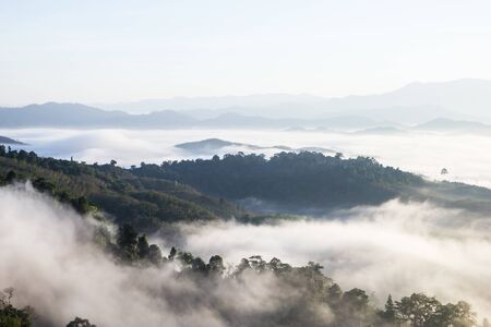 The sun rises in the mist at Khao Kai Nui, Phangnga Thailandの写真素材