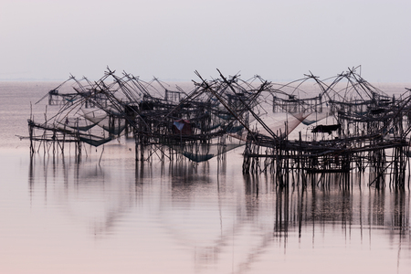 Silhouette of big fish net trapの写真素材
