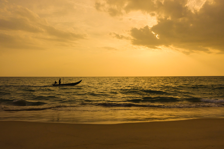 Fishing boats in the sea and sunsetsの写真素材