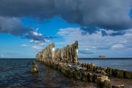 Wooden breakwaters line at Baltic Sea in Babie Doly, Gdynia, Polandの写真素材