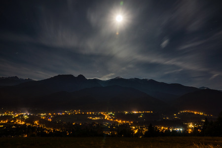 Tatra mountains and Zakopane at night from Koscielisko, Polandの写真素材