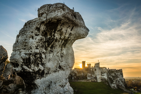 Sunset over the ruins of medieval castle Ogrodzieniec in Podzamcze, Silesia, Polandの写真素材