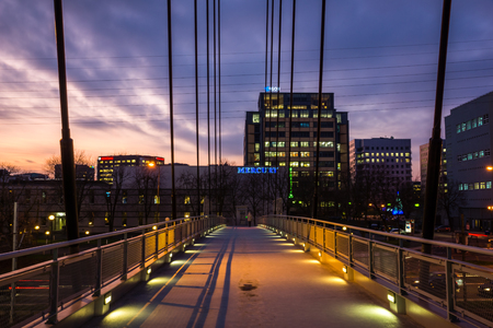 Night view of the office buildings at WoÅoska street in SÅuÅ¼ewiec, part of the MokotÃ³w district, Warsaw, Polandのeditorial素材