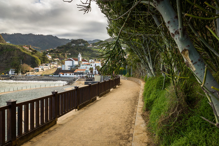 Path over the ocean shore near Porto da Cruz on the Madeira island, Portugal