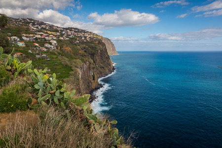 Cliff over the Atlantic ocean in Ribeira Brava on the Madeira island, Portugalの写真素材