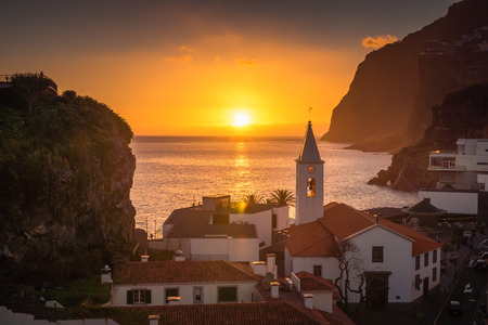 Sunset over the church in Camara de Lobos, Madeira, Portugalの写真素材
