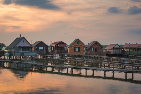 Wooden cottages on the Bokod lake in Hungaryの写真素材