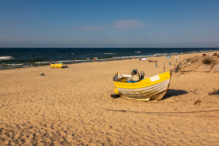 Fishing boat on the beach in Krynica Morska, Pomorskie, Polandの写真素材