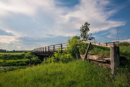 Wooden bridge over the Radomka river, Masovia, Polandの写真素材