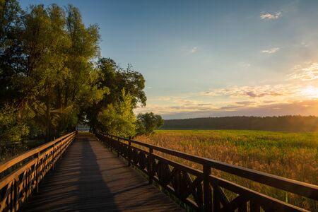 Footbridge on the Olecko Wielkie lake in Olecko, Masuria, Poland