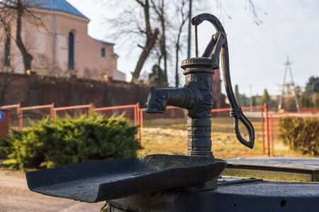 Hand pump for wells near church in Warka, Masovia, Polandの写真素材