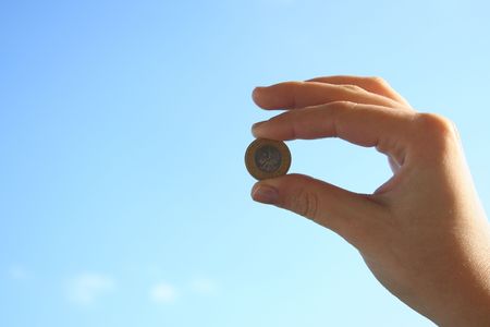 Coin on skyの写真素材