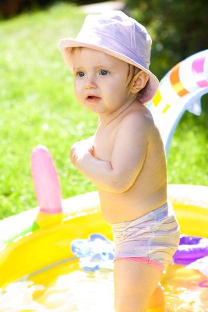 Sweet baby girl in gardenの写真素材