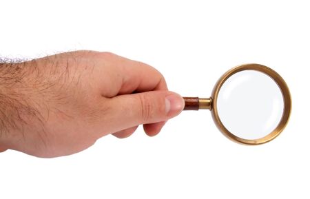 Hand holding magnifying glass, isolated on whiteの写真素材