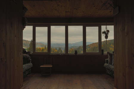 View from the window of an old wooden house in the mountains.の写真素材