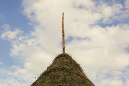 Roof with blue sky and white clouds in the background.の写真素材