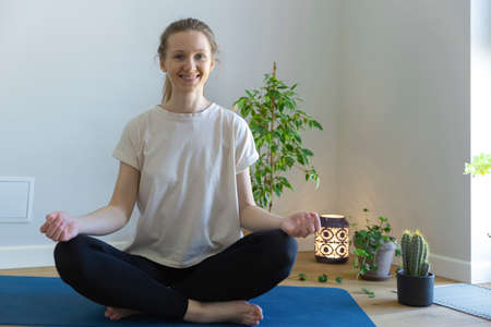 woman sitting cross-leggedの写真素材