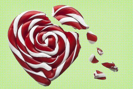 Broken candy heart on textured backgroundの写真素材