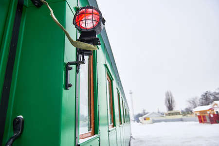 Side light on green locomotive railway carriageの写真素材