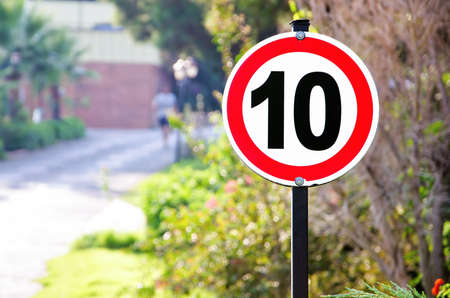 Speed limit sign in park near the treeの写真素材