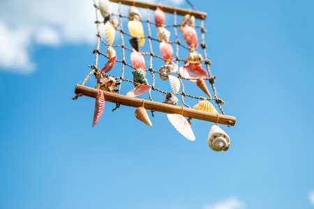 Suspension of shells against the blue skyの写真素材